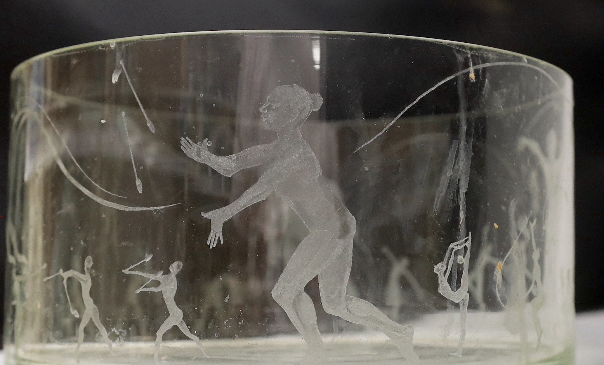 A large glass bowl engraved with artistic gymnastic scenes, 30cm diameter